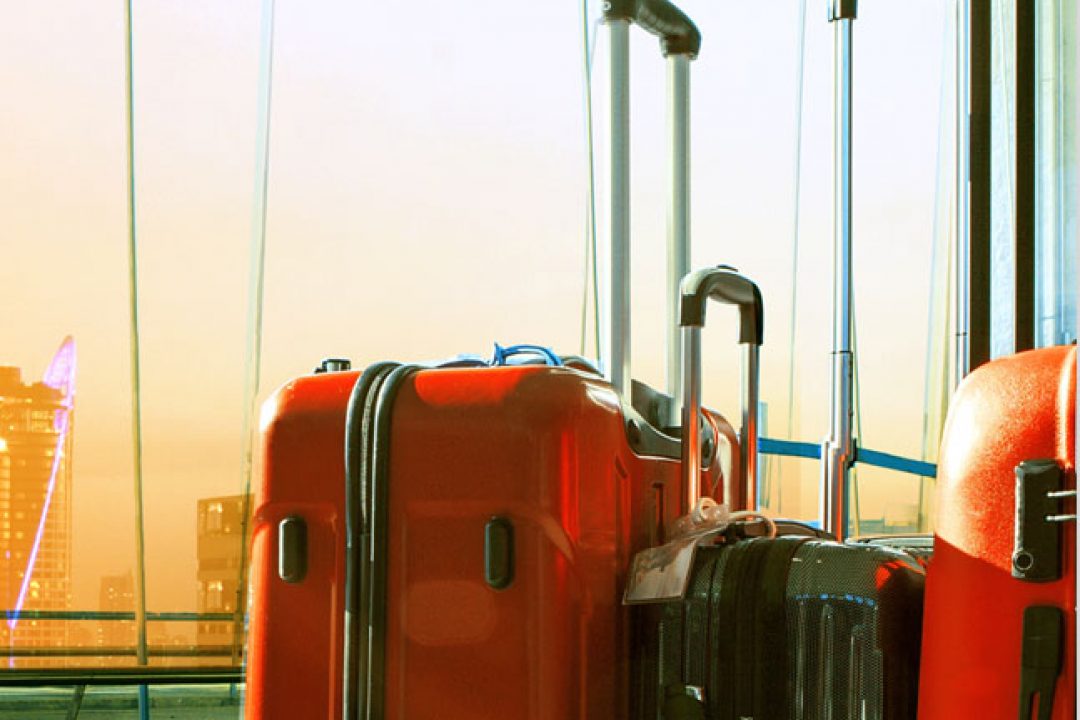 Side view of red and black suitcases