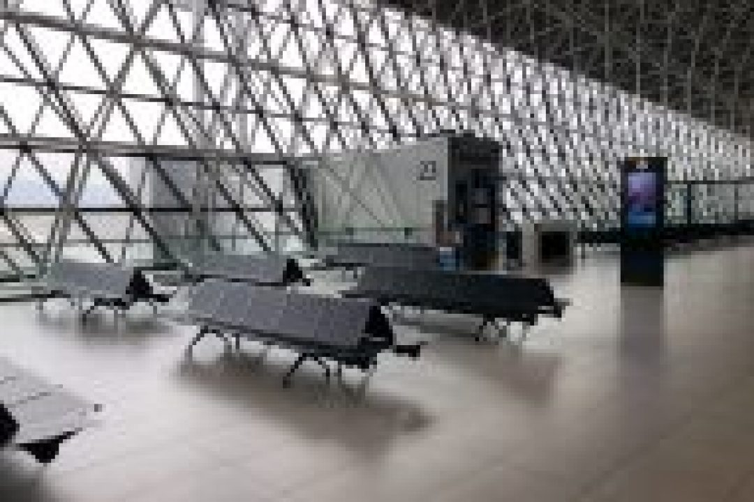 Empty waiting area by airport gate.