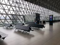 Empty waiting area by airport gate.